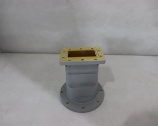 What are the key differences in performance and design principles between circular waveguide transitions for low-frequency and high-frequency applications?